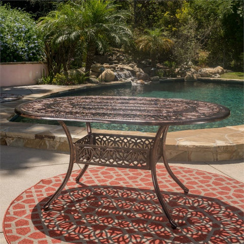 Noble House Tahoe 59.2" Oval Cast Aluminum Patio Dining Table in Shiny Copper